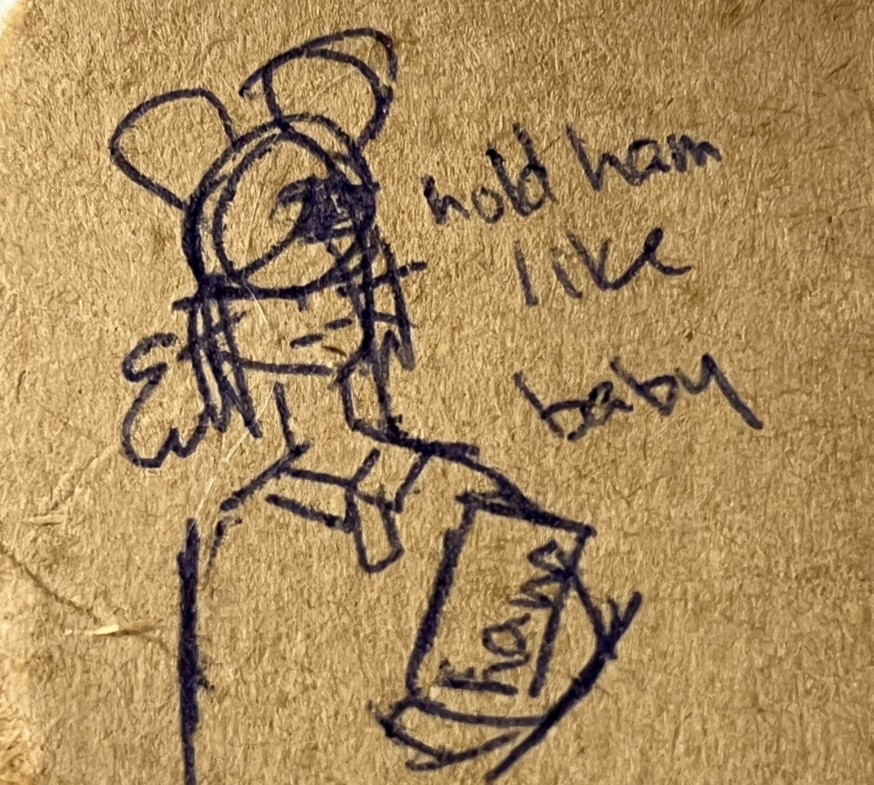 Crappy doodle of Brie holding a cooked ham, captioned 'hold ham like baby'